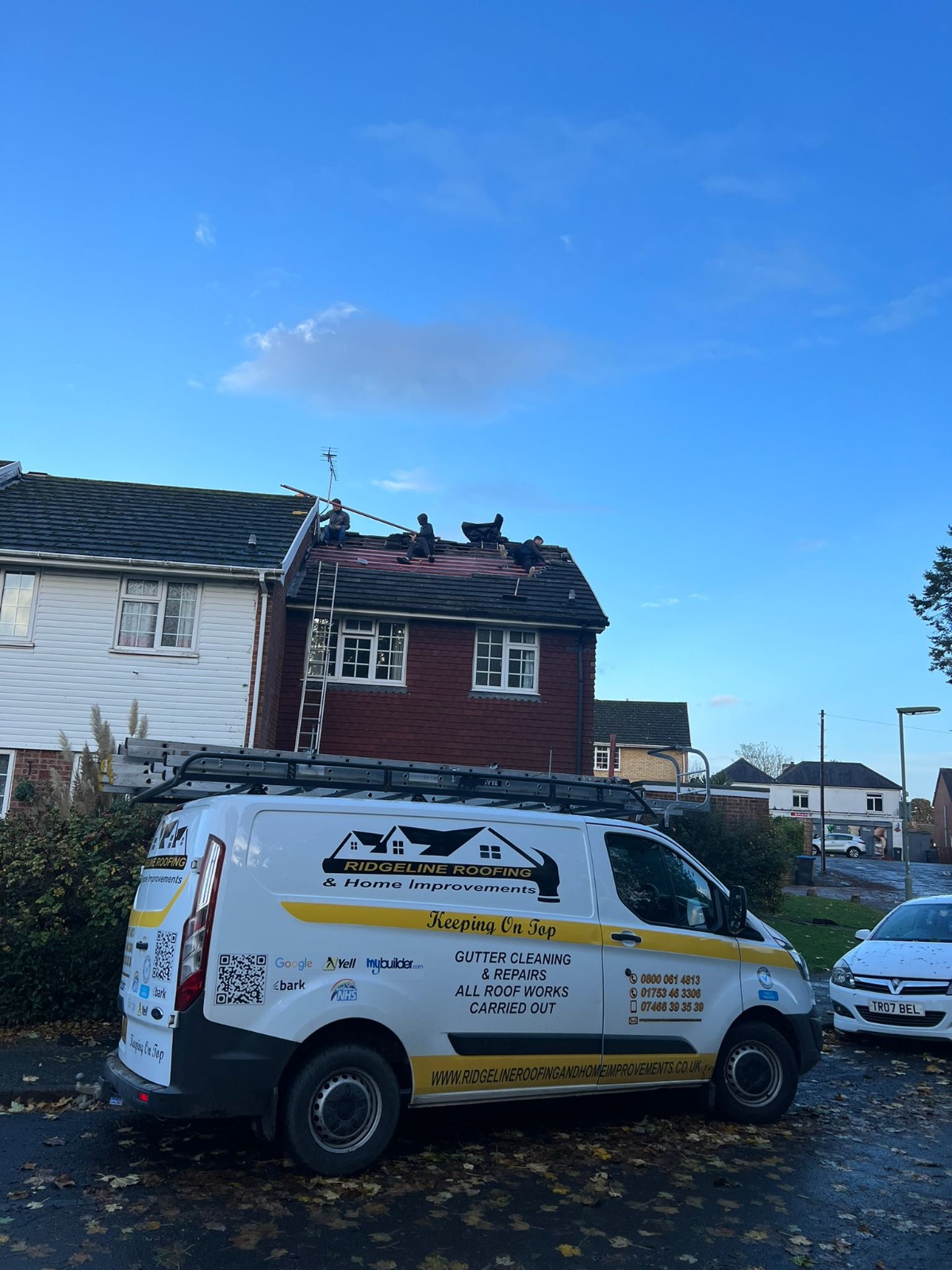 Roofer inspecting damaged roof